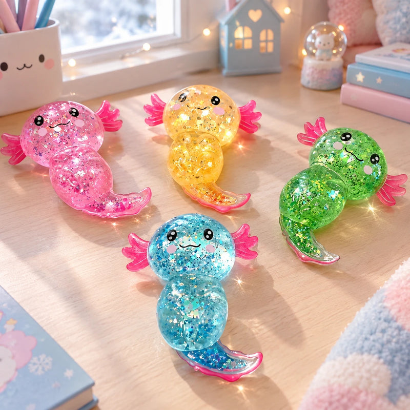 The 4 glitter axolotl squishies: pink, yellow, green and blue